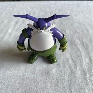Purple and Green Cartoon Character Figure From Sonic
